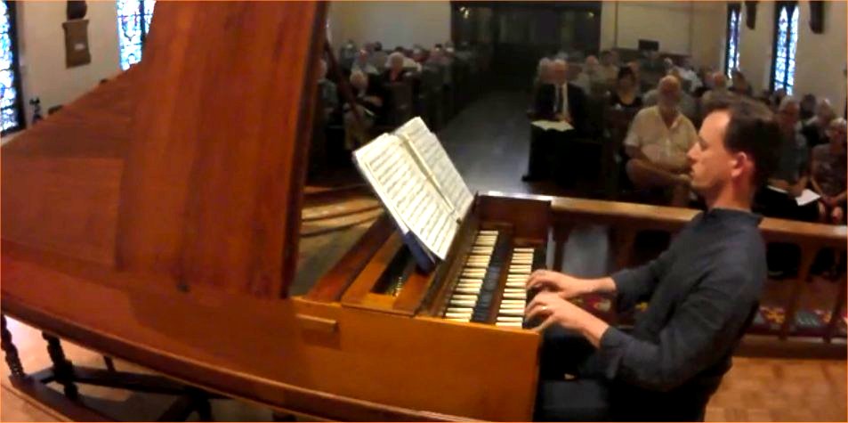 Performing on harpsichord
